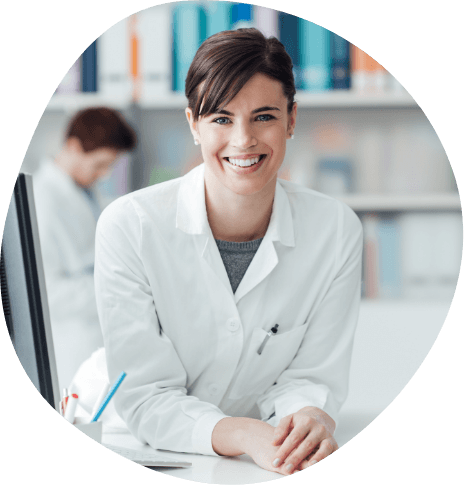 Smiling woman in white lab coat