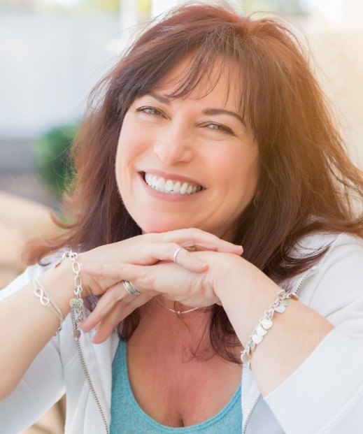 Woman grinning after sleep treatments in Denton