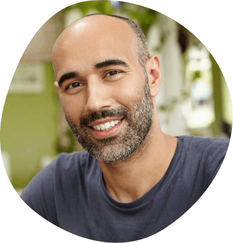 Smiling man in dark blue shirt