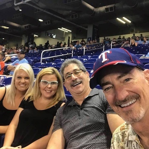 Doctor Kent Smith at a Texas Rangers game with family