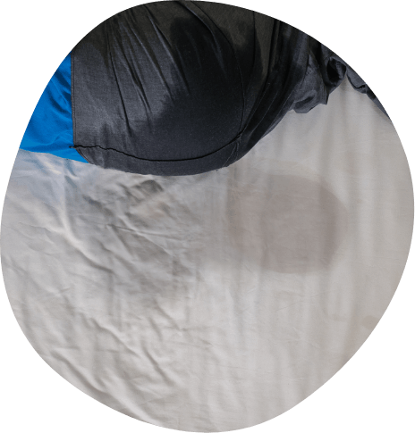 Wet spot on white bedsheets