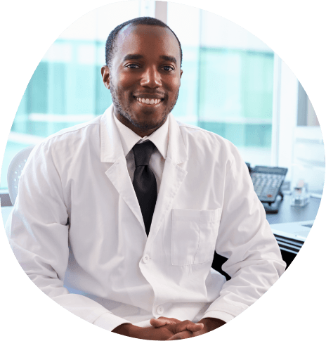 Smiling man in white lab coat