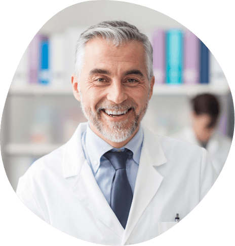 Smiling man in white lab coat