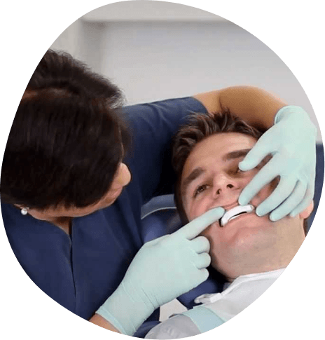 Sleep doctor fitting a patient with an oral appliance