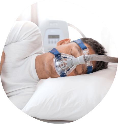 Man sleeping on his side and wearing C P A P mask