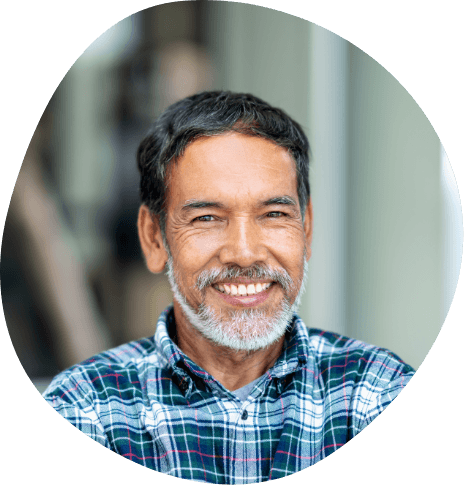 Smiling older man in blue plaid shirt