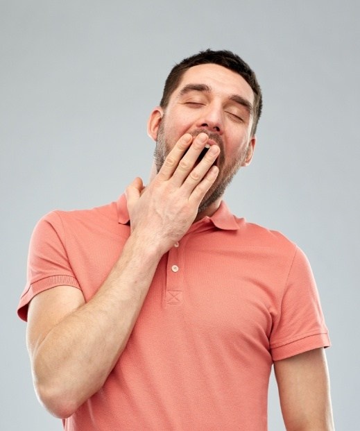 Man yawning before sleep apnea treatment in Denton