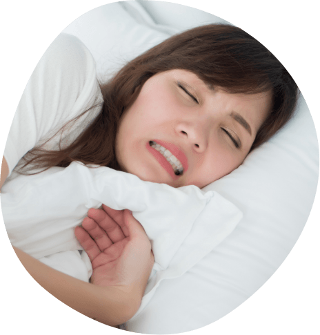 Woman grimacing while sleeping