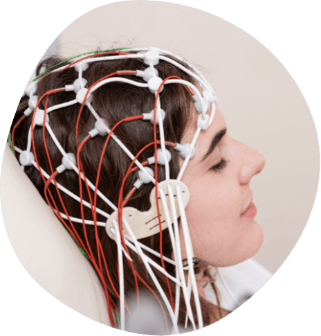 Woman wearing electrodes on her head for sleep testing