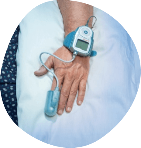Hand wearing sensor on finger during sleep test
