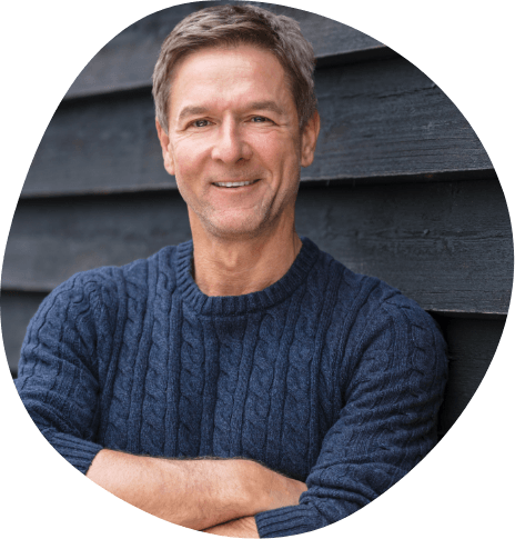 Smiling man in dark blue sweater