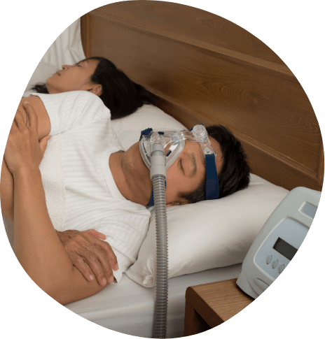 Sleeping man wearing C P A P machine