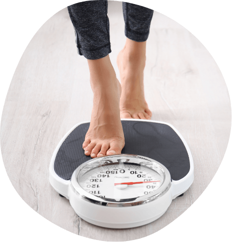 Person stepping on bathroom scale