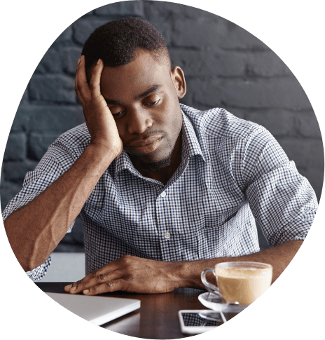 Man struggling to stay awake at work