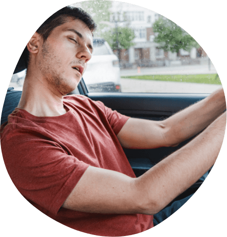 Young man falling asleep while driving