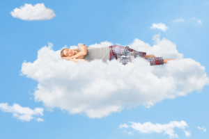 a person sleeping on an imaginary cloud